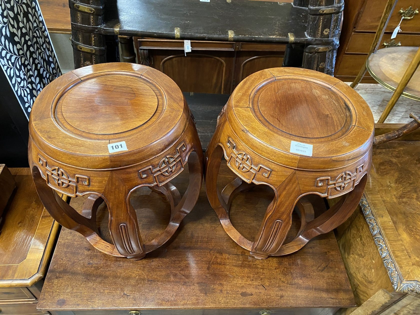 A pair of Chinese carved hardwood vase stands, diameter 36cm, height 47cm